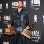 Rudy Gobert holds up Defensive Player of the Year Award at NBA Awards presentation