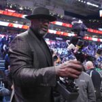 Feb 18, 2023; Salt Lake City, UT, USA; Shaquille O'Neal films himself with a camera during the 2023 All Star Saturday Night at Vivint Arena. Mandatory Credit: Kyle Terada-USA TODAY Sports