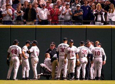 Teammates surround Minnesota Twins right fielder C