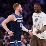 Minnesota Timberwolves guard Donte DiVincenzo (0) celebrates with forward Julius Randle (30)