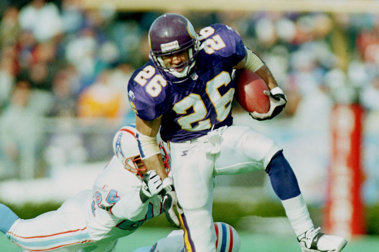 Vikings at Tennessee Oilers — Minnesota Vikings running back Robert Smith #26, makes his way through the Tennesse Oilers defense in the second quarter of Saturday’s game at Vanderbilt Stadium in Nashville, TN. The Vikes won by a final score 26-16.(Photo