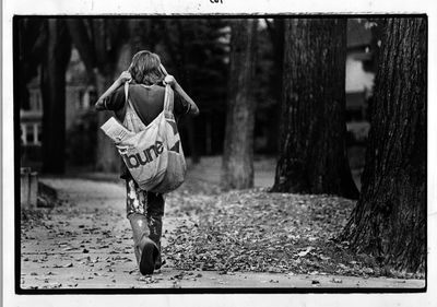 paper carriers / Chuck Johnson, paperboy for 2 1/2 months, delivers newspapers along his route (45th Street to Lake Harriet) October 14, 1975, Minneapolis Tribune photo by Bruce Bisping (Star Tribune file photo).