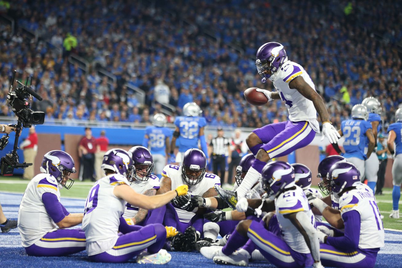 Minnesota Vikings wide receiver Stefon Diggs (14) jumped in the circel to join his teammates for a Thanksgiving meal celebration after quarterback Case Keenum (7) scored in the first quarter at Ford Field Thursday November 23, 2017 in Detroit , MI.] The D