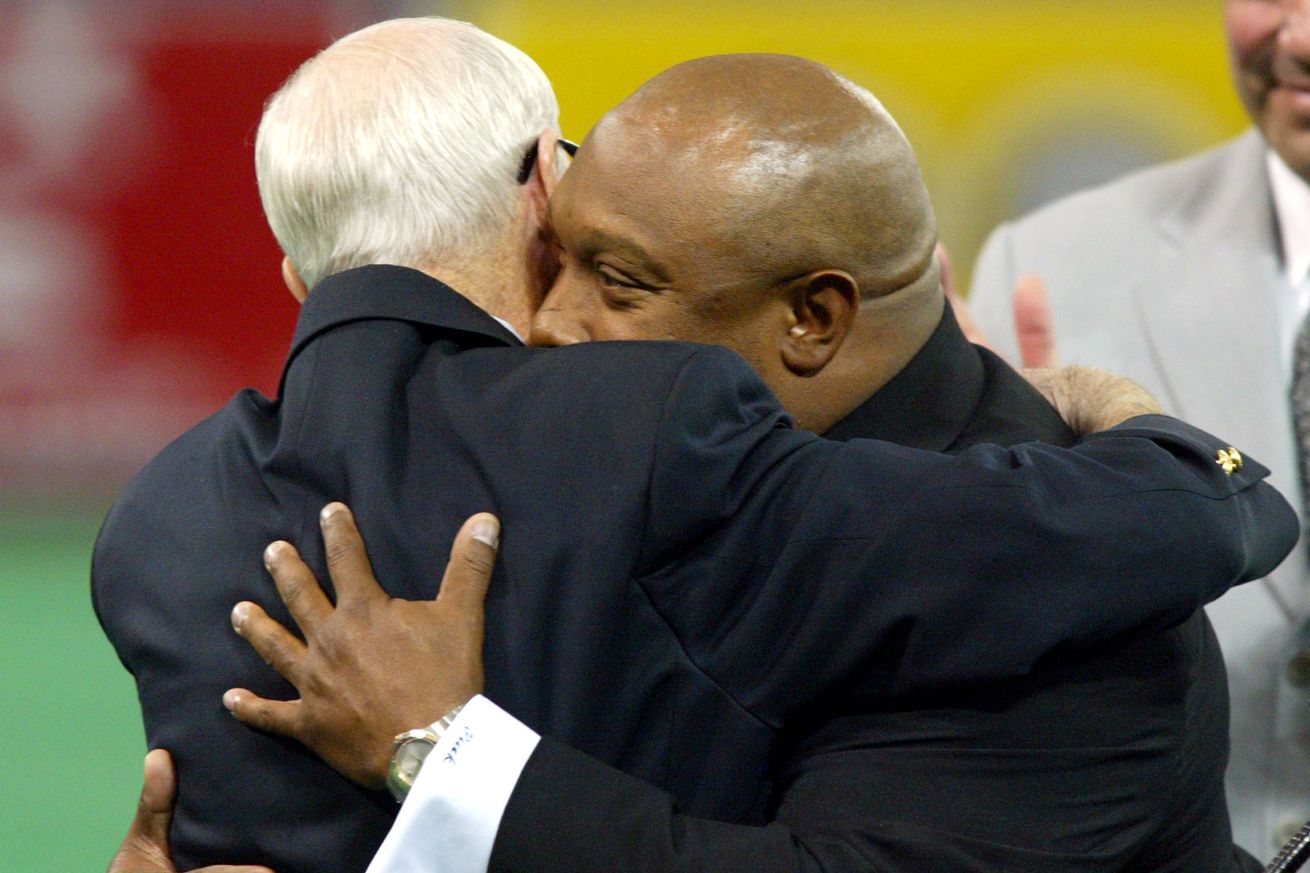 05/31/03 - Twins vs Seattle IN THIS PHOTO: Twins P.A. announcer Bob Casey, left and former Twins player Kirby Puckett hug during pre-game festivities in which Casey was inducted into the Twins hall of fame. Minnesota Twins baseball