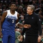 Minnesota Timberwolves head coach Chris Finch talks with guard Anthony Edwards